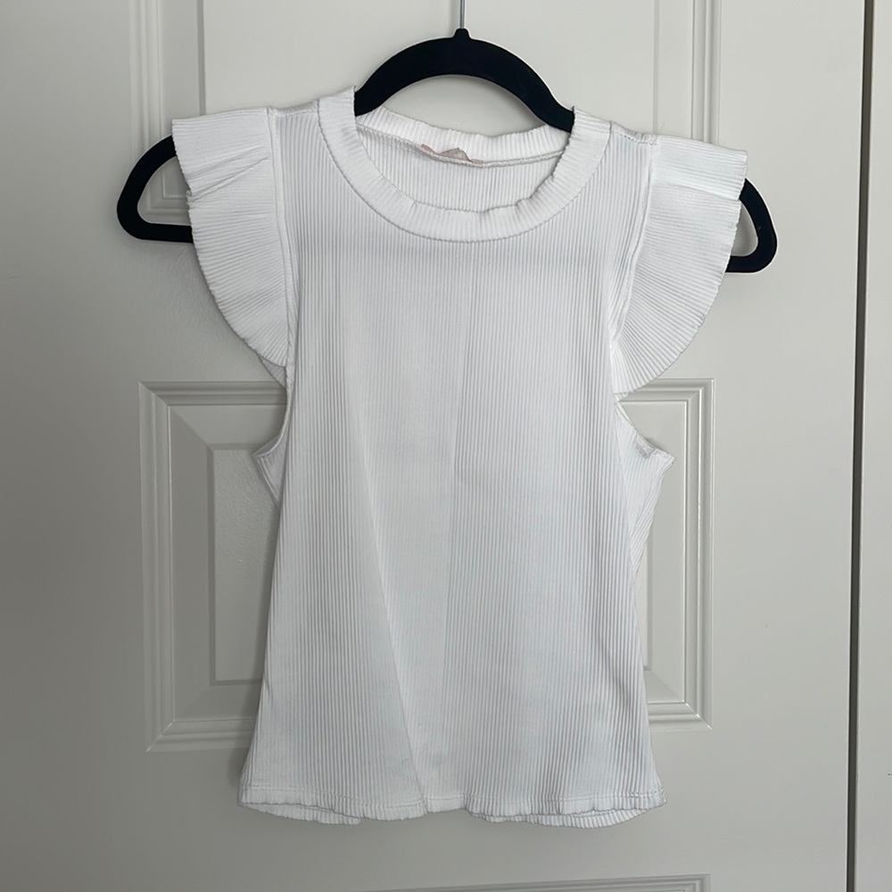 White sleeved, ribbed tank.